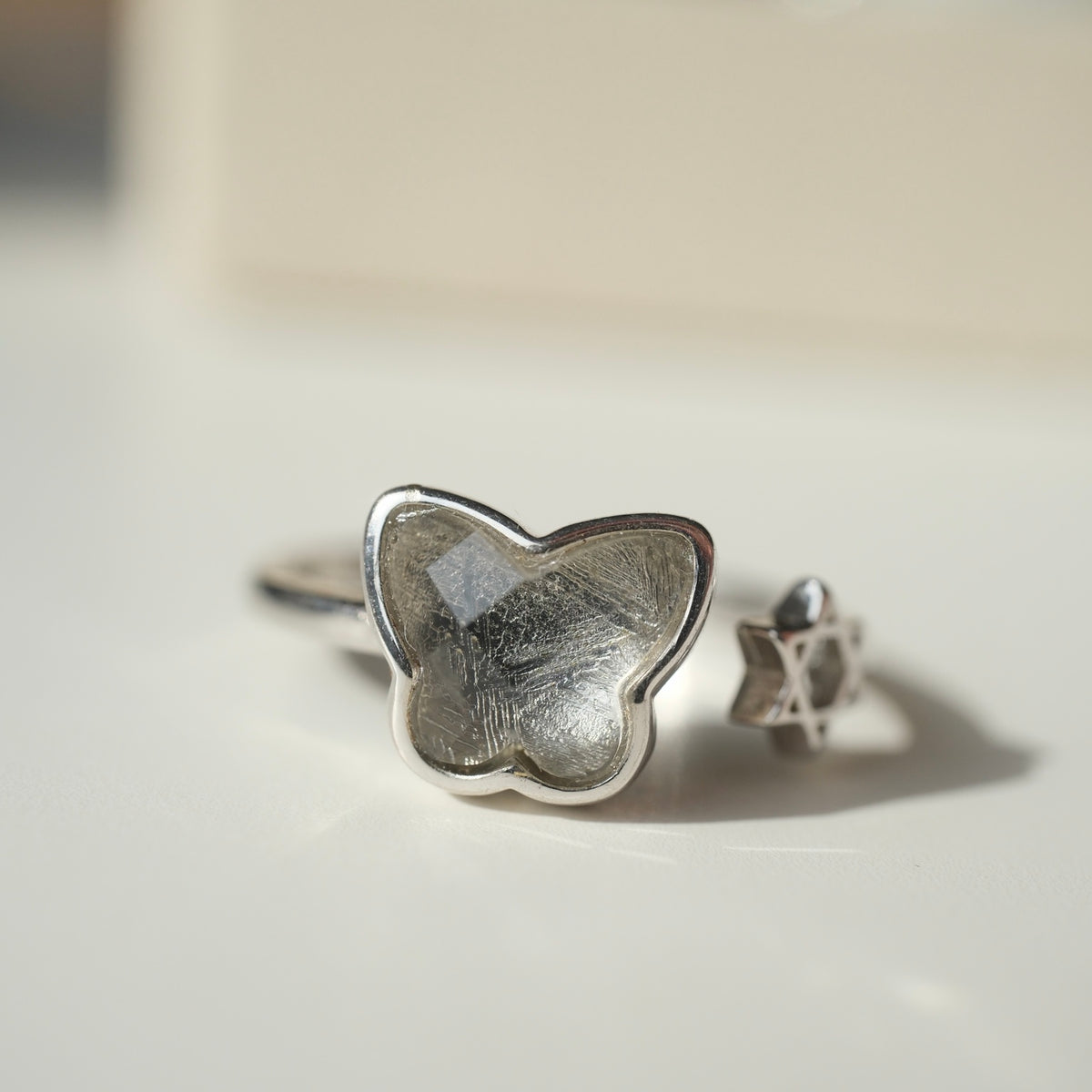 S925 butterfly ring with patterned centre and six-pointed star detail