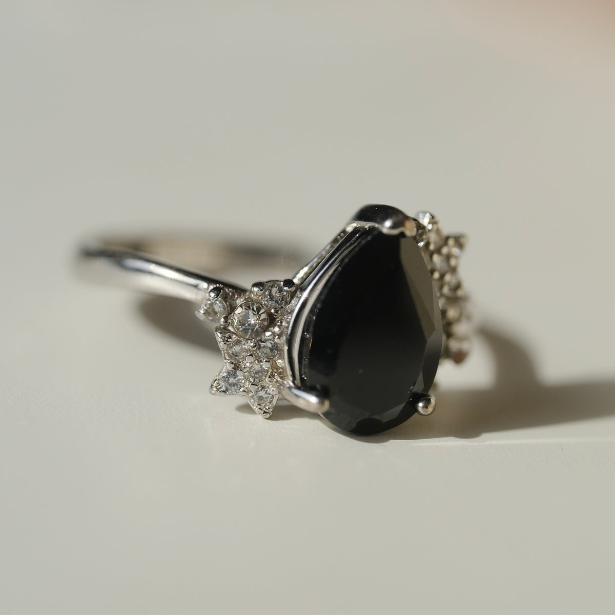 Black Spinel teardrop S925 adjustable ring with clear stone and star accents