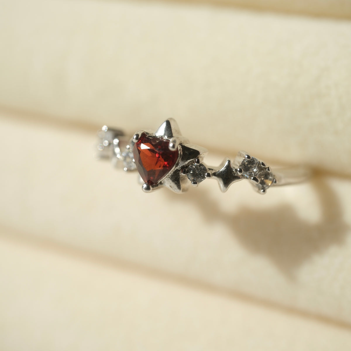 Garnet Star S925 adjustable ring with a red heart-shaped stone, silver star details and clear accent stones