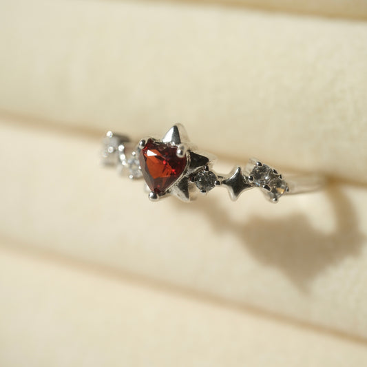 Garnet Star S925 adjustable ring with a red heart-shaped stone, silver star details and clear accent stones