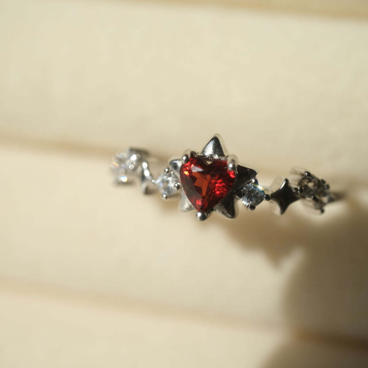 Garnet Star S925 adjustable ring with a red heart-shaped stone, silver star details and clear accent stones