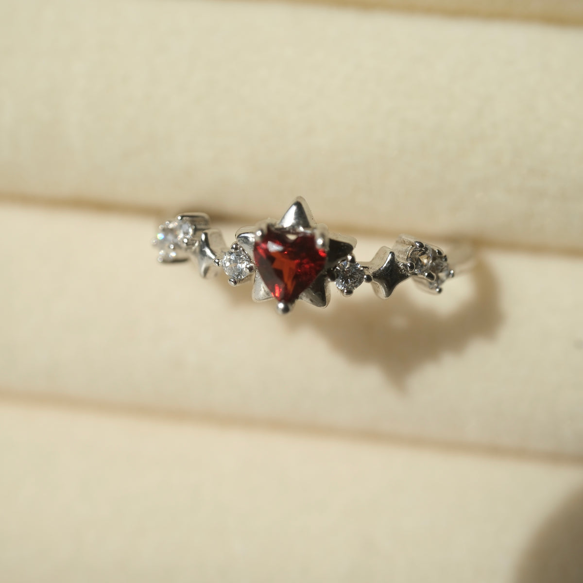 Garnet Star S925 adjustable ring with a red heart-shaped stone, silver star details and clear accent stones