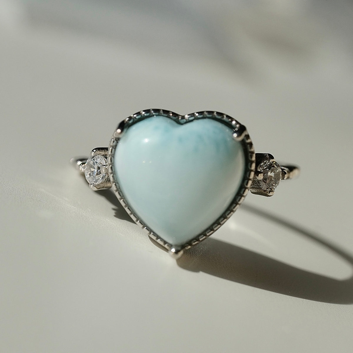 Pale blue Larimar heart S925 adjustable ring with clear side accents, view 1