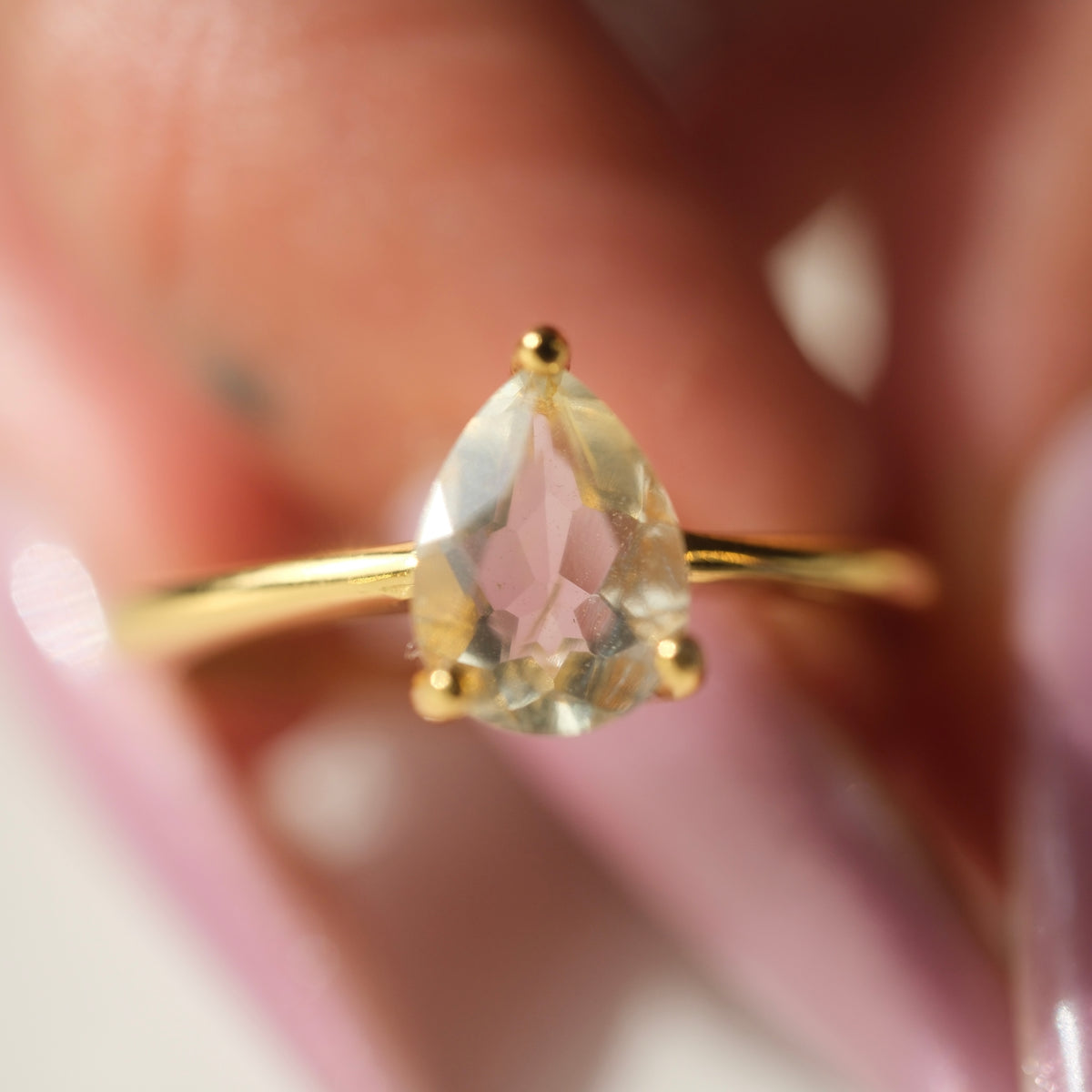 Libyan Desert Glass teardrop S925 adjustable ring with a faceted pale yellow stone and a slim gold-coloured band