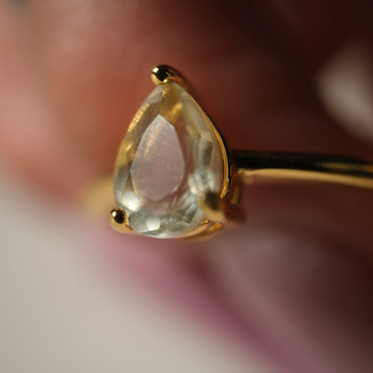 Libyan Desert Glass teardrop S925 adjustable ring with a faceted pale yellow stone and a slim gold-coloured band