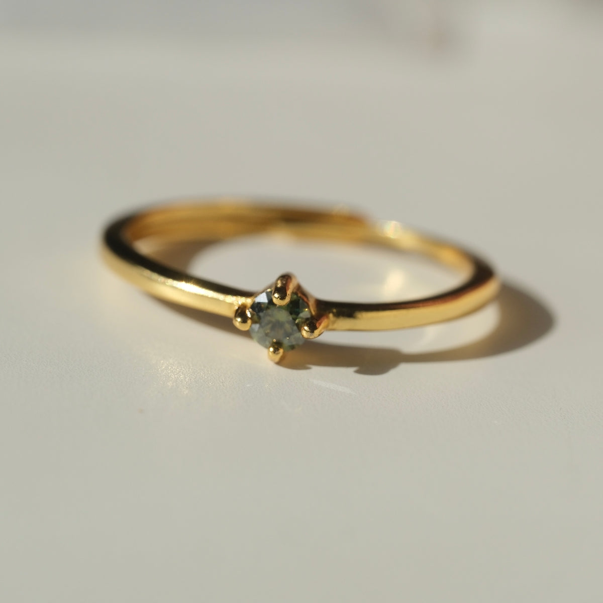 Green Moissanite ring angled view