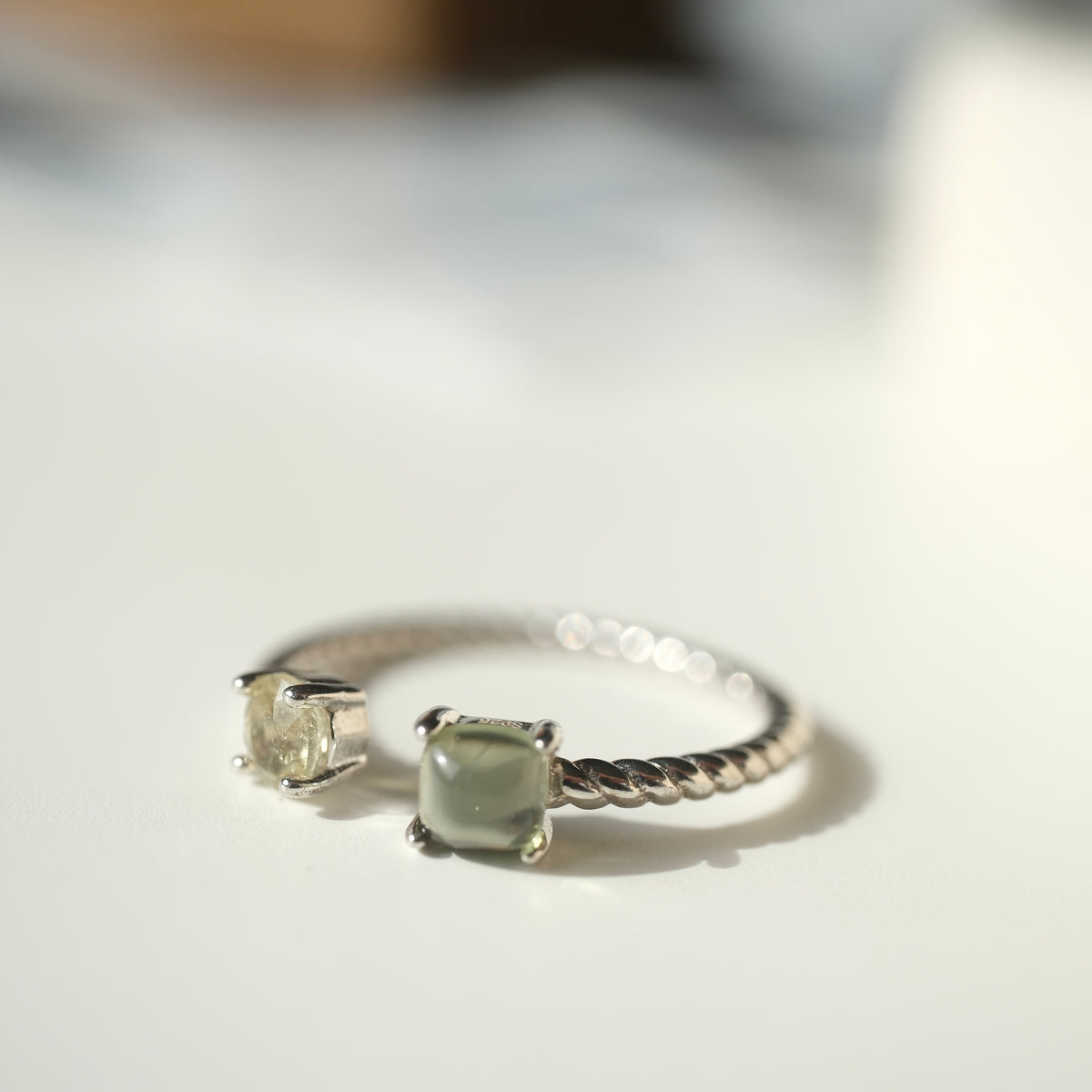 Moldavite and Libyan Desert Glass S925 adjustable ring with two stones in an open setting and a twisted silver band