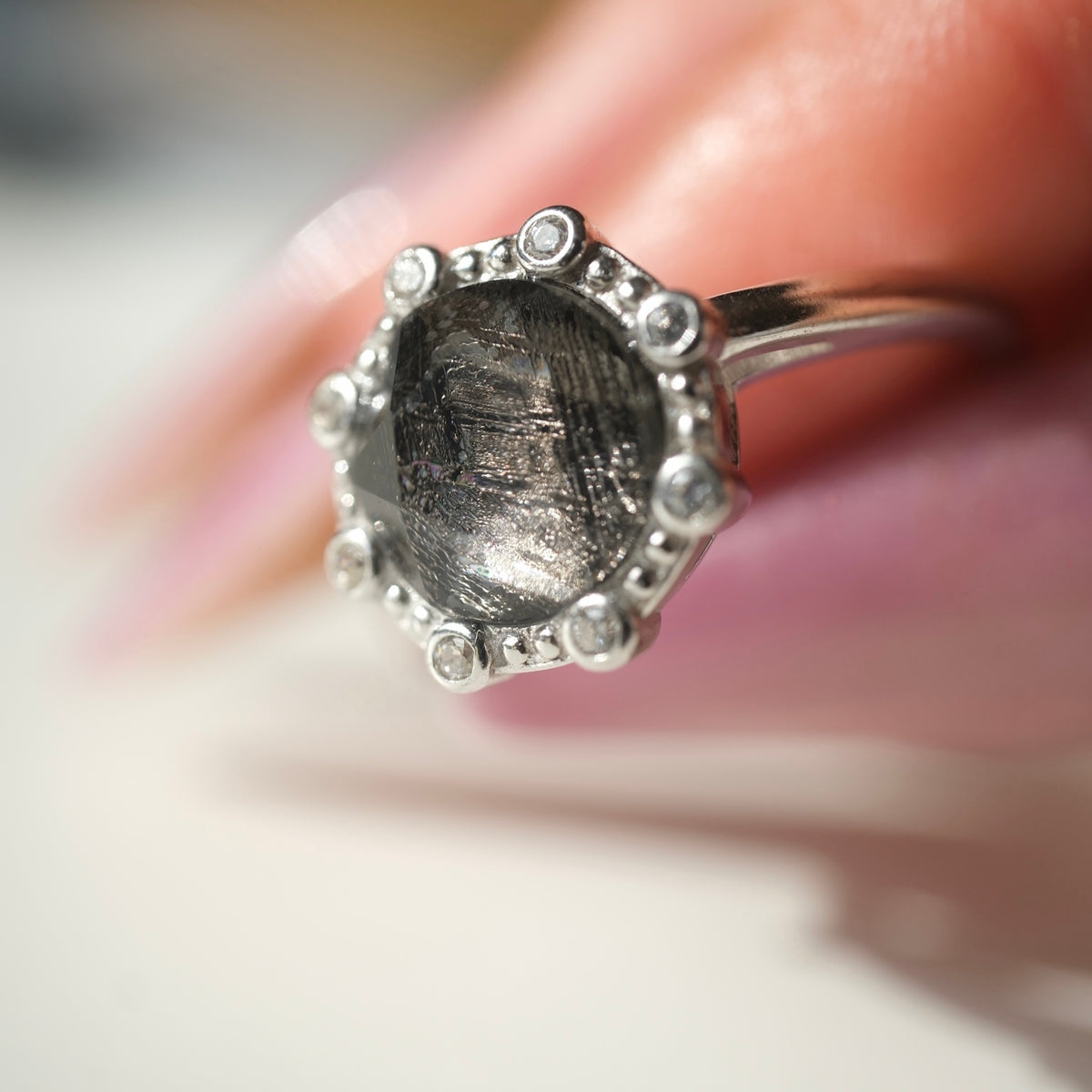 Angled close-up of the Muonionalusta meteorite ring