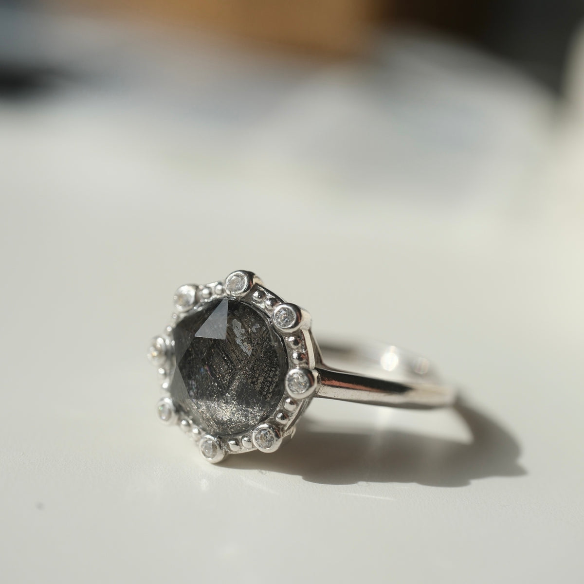 Muonionalusta meteorite S925 adjustable ring with clear halo accents, side view