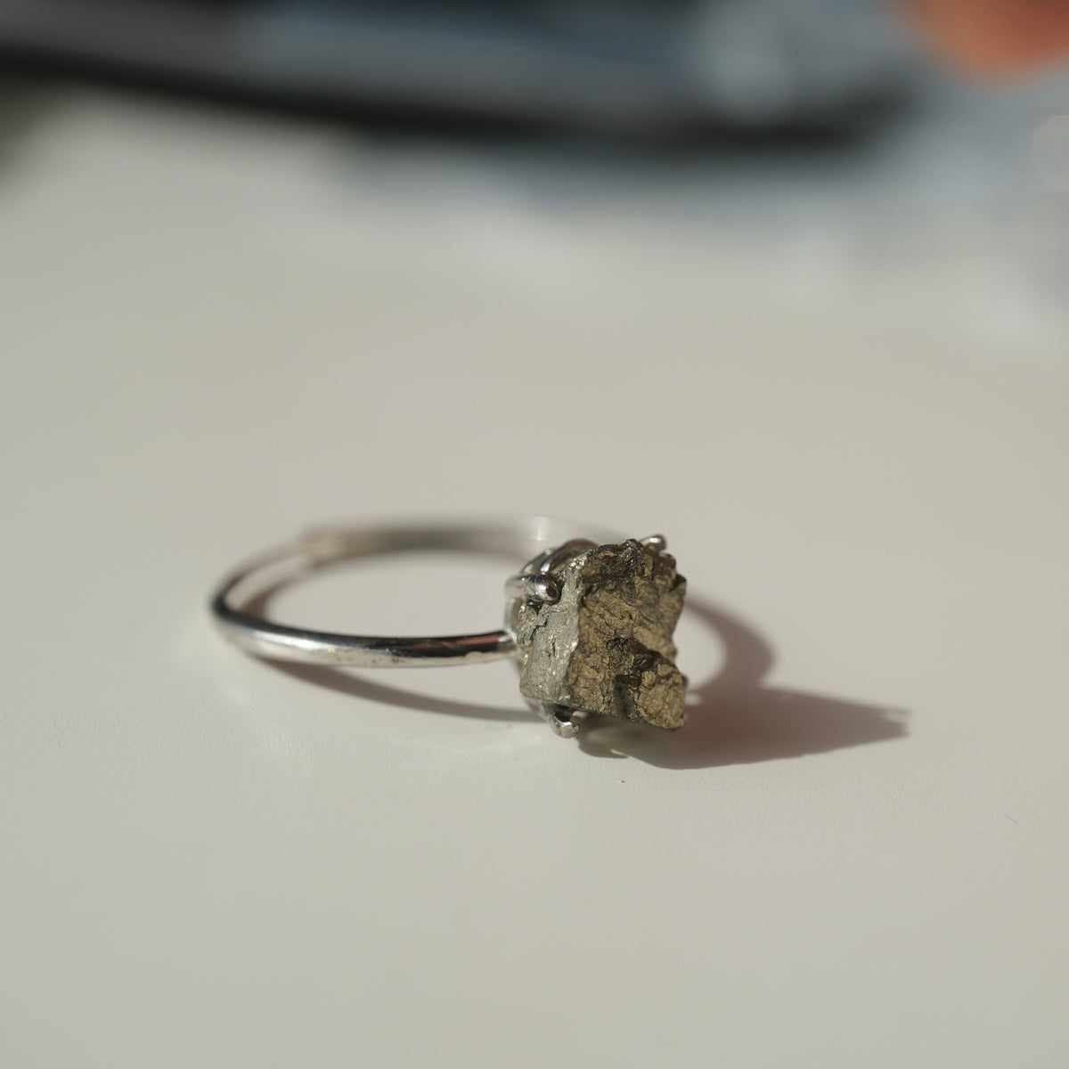 Two raw Pyrite S925 adjustable rings showing their natural stone variations
