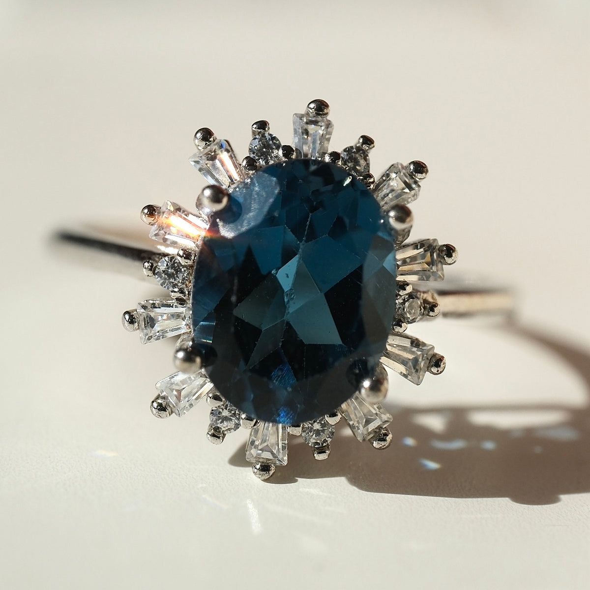 Oval London Blue Topaz halo ring front view