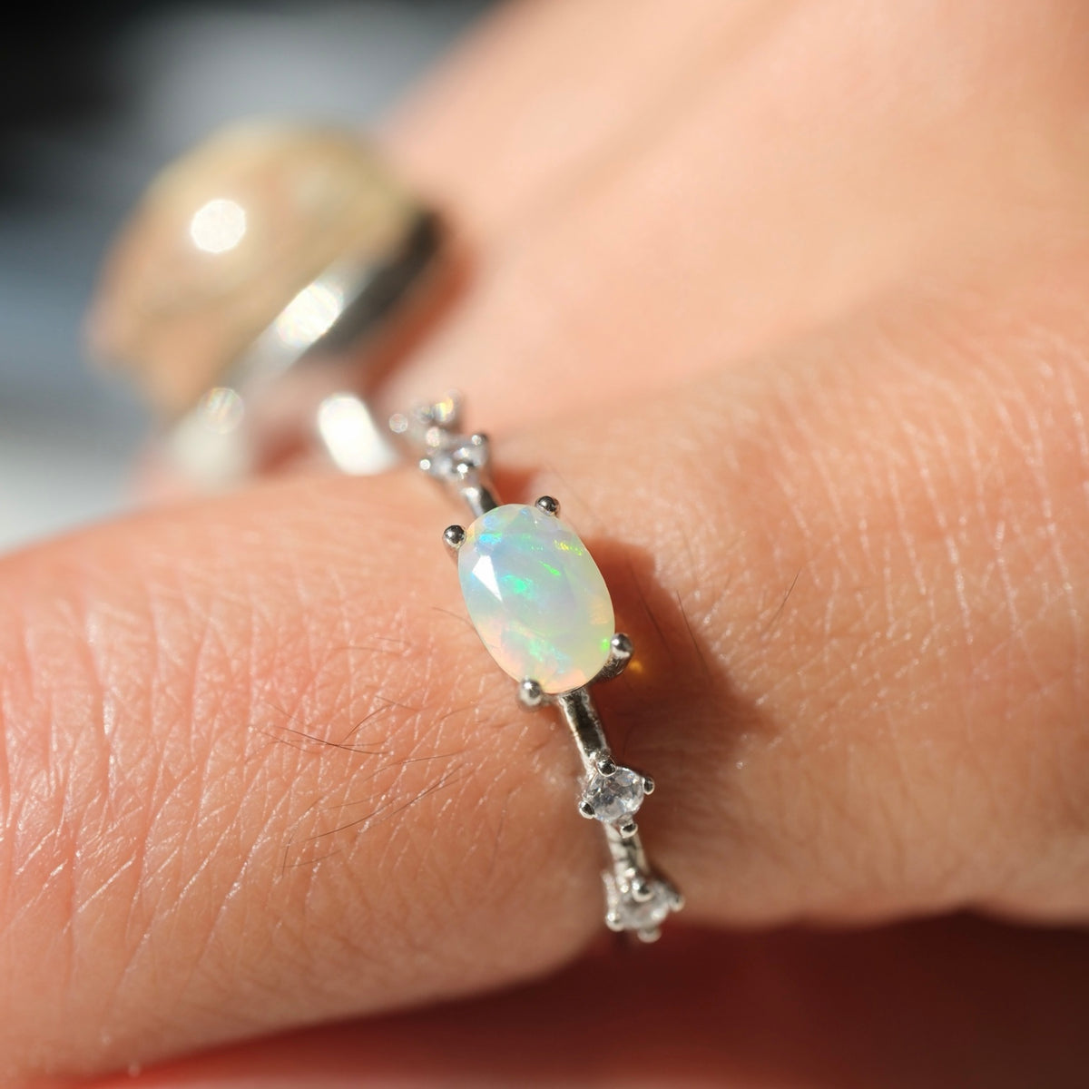 White Opal S925 adjustable ring worn on a hand