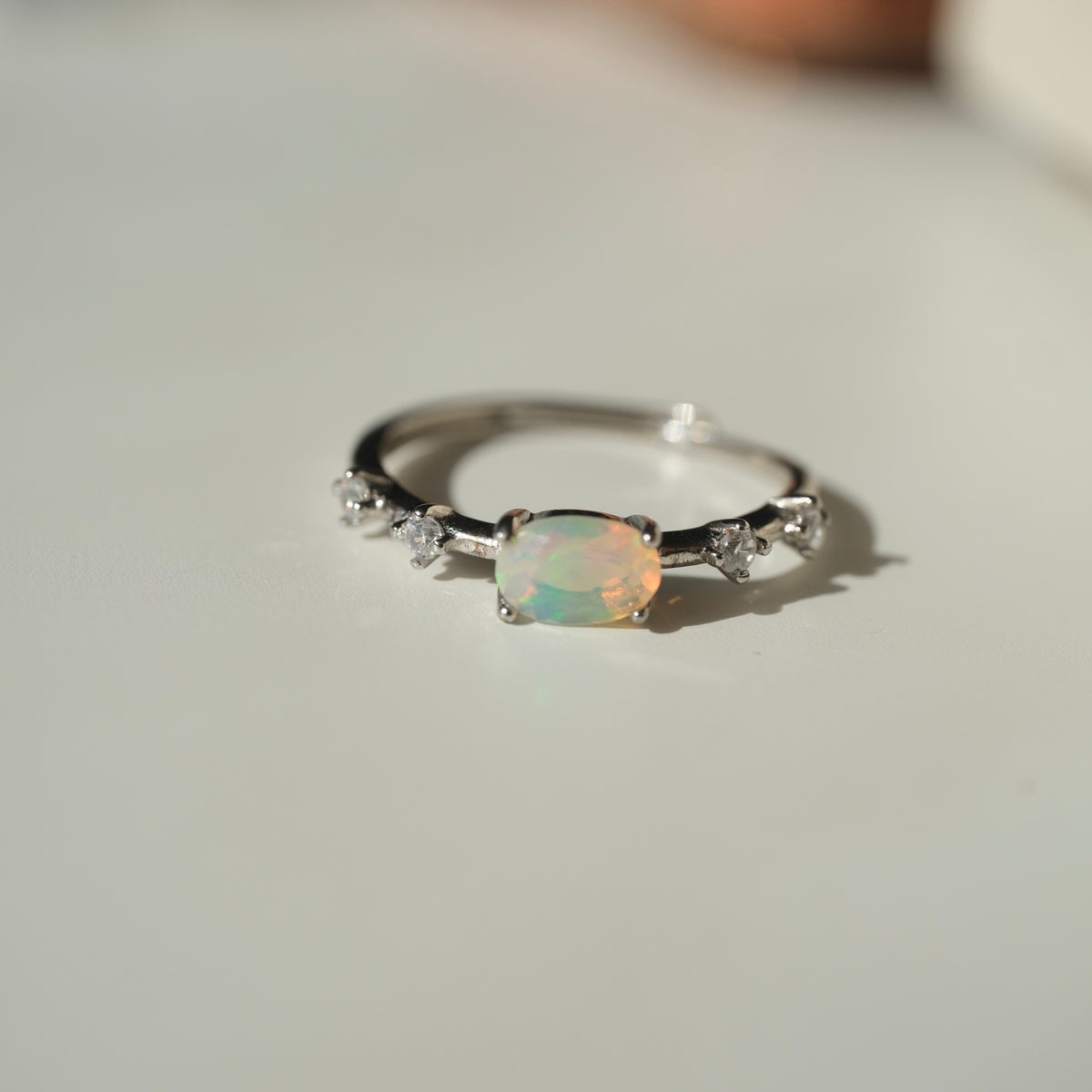 White Opal S925 adjustable ring, oval opal and clear accent stones, view 3